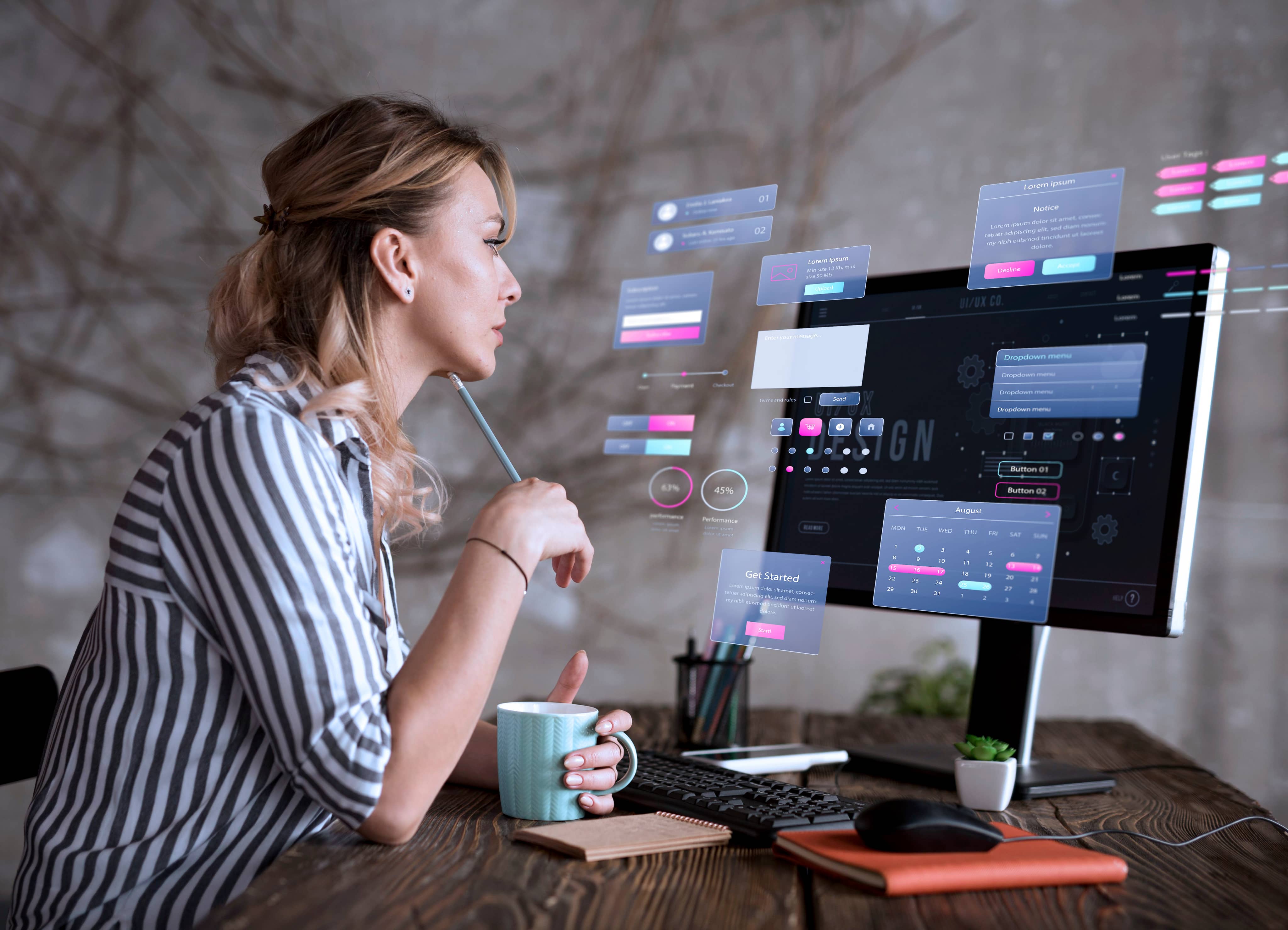 Professional woman working on computer with multiple monitors